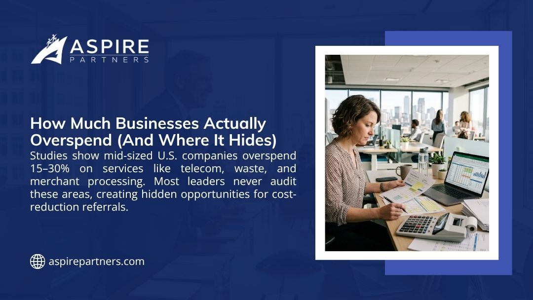 Woman analyzing financial reports at her desk, highlighting how businesses overspend 15–30% on hidden costs like telecom and merchant processing.