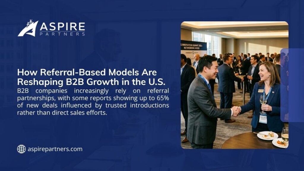 Business professionals networking at a B2B summit, illustrating how referral-based models drive up to 65% of new B2B deals in the U.S.