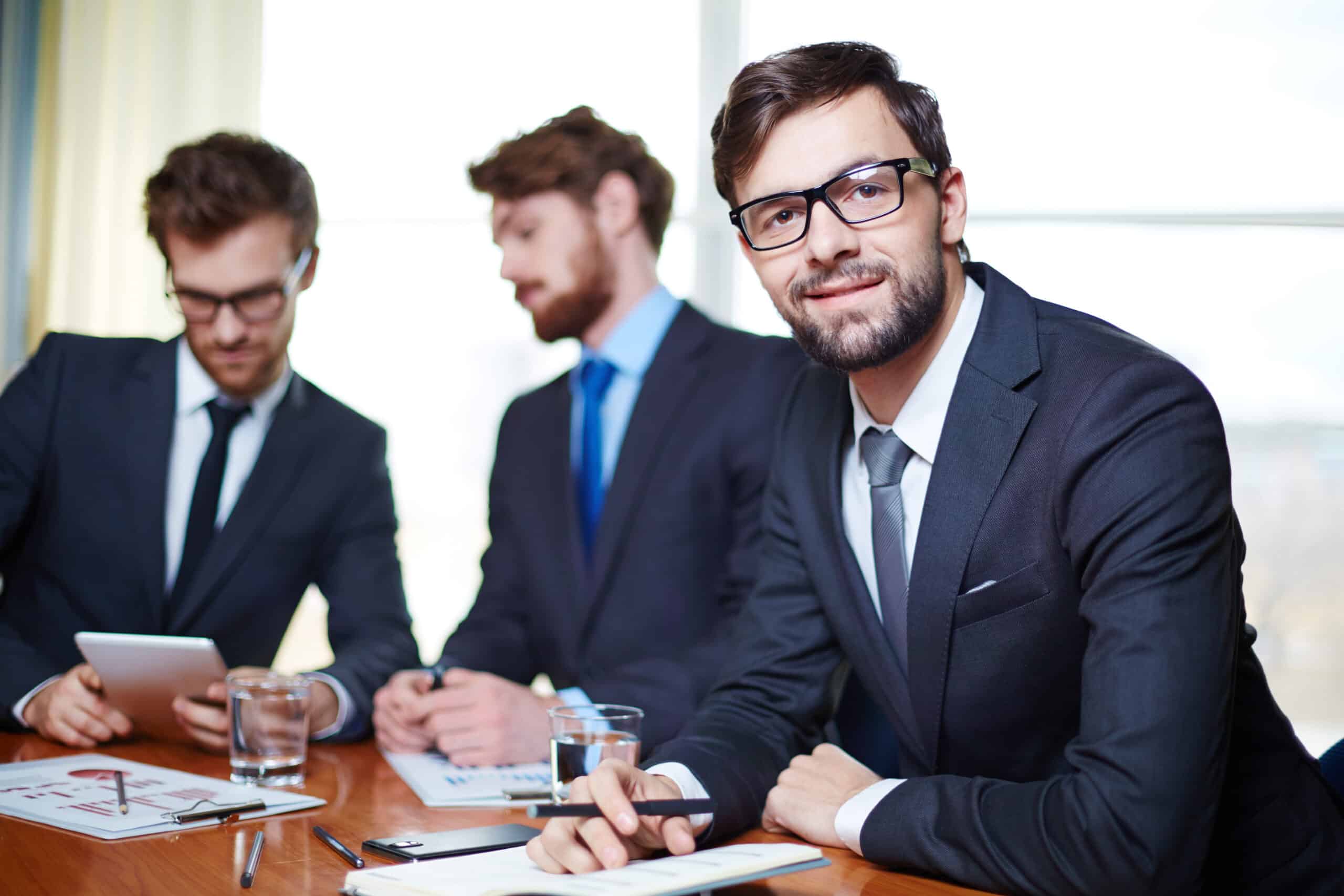 Executives with co-workers